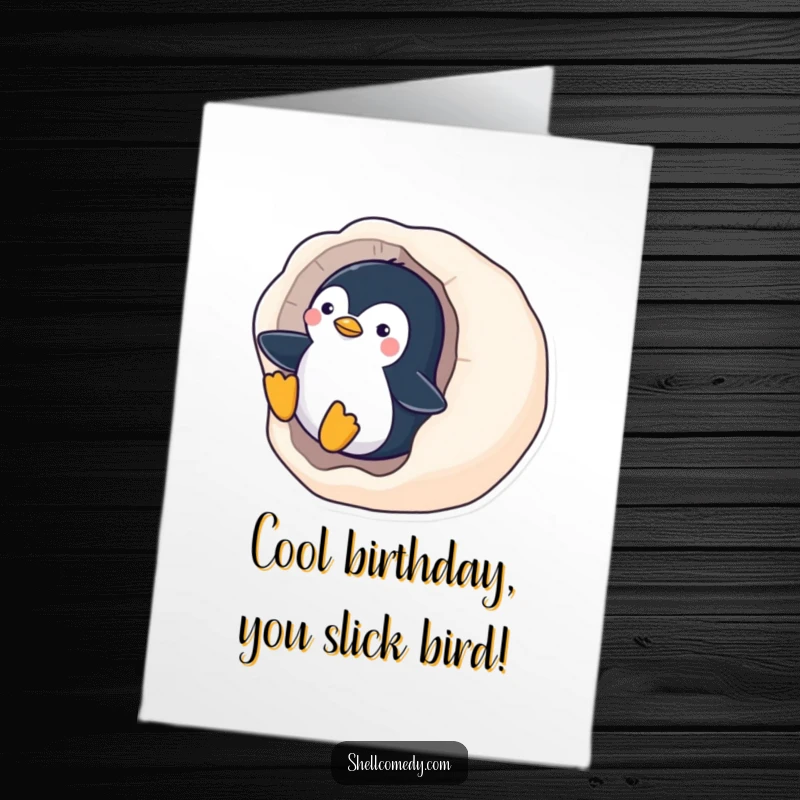 Funny Free Printable Birthday Card: A playful penguin gleefully slides down the smooth surface of a polished seashell.